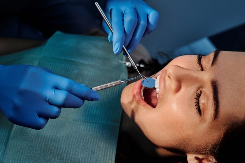 Dentist checking teeth for early cavities